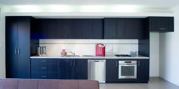 Ascot Tce galley kitchen dark timber overhead cupboards villa custom
